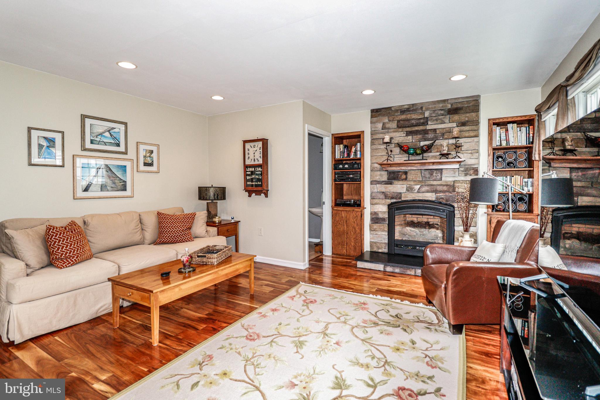 94 Winding Way Hamilton, NJ 08620 - Photo 20 of 38 a living room with furniture a rug and a fireplace