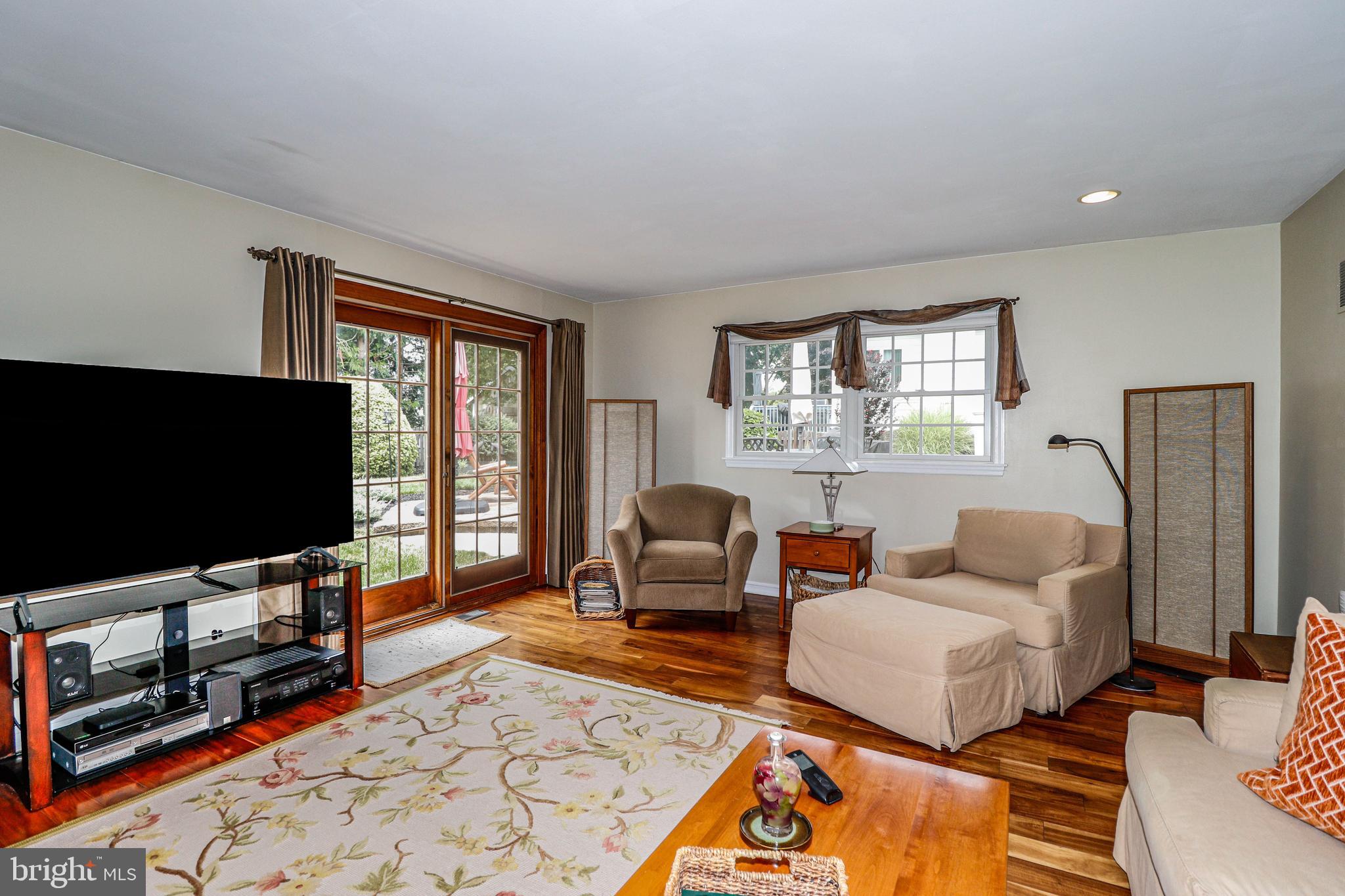 94 Winding Way Hamilton, NJ 08620 - Photo 21 of 38 a living room with furniture and a flat screen tv