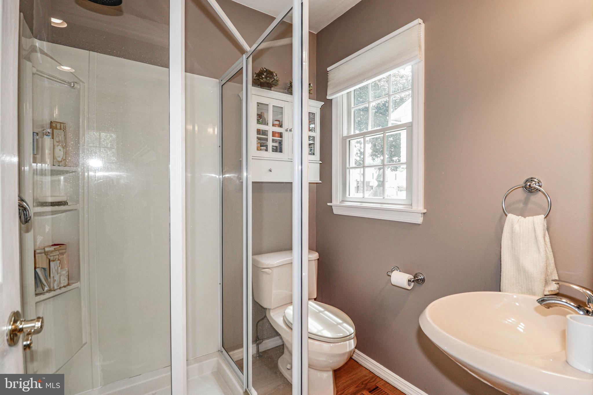 94 Winding Way Hamilton, NJ 08620 - Photo 24 of 38 a bathroom with a sink toilet and shower