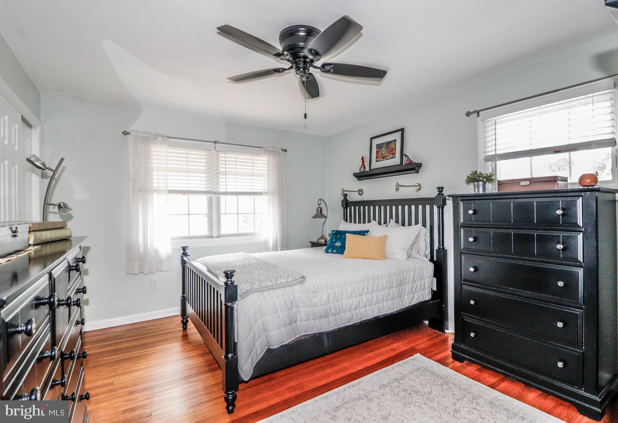 94 Winding Way Hamilton, NJ 08620 - Photo 25 of 38 a bedroom with a bed and a chandelier