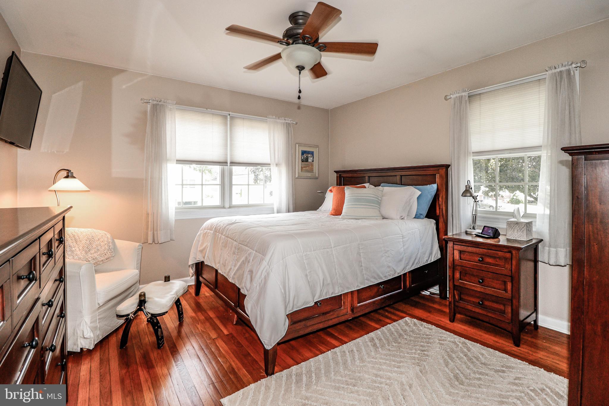 94 Winding Way Hamilton, NJ 08620 - Photo 27 of 38 a bedroom with a bed and a chandelier