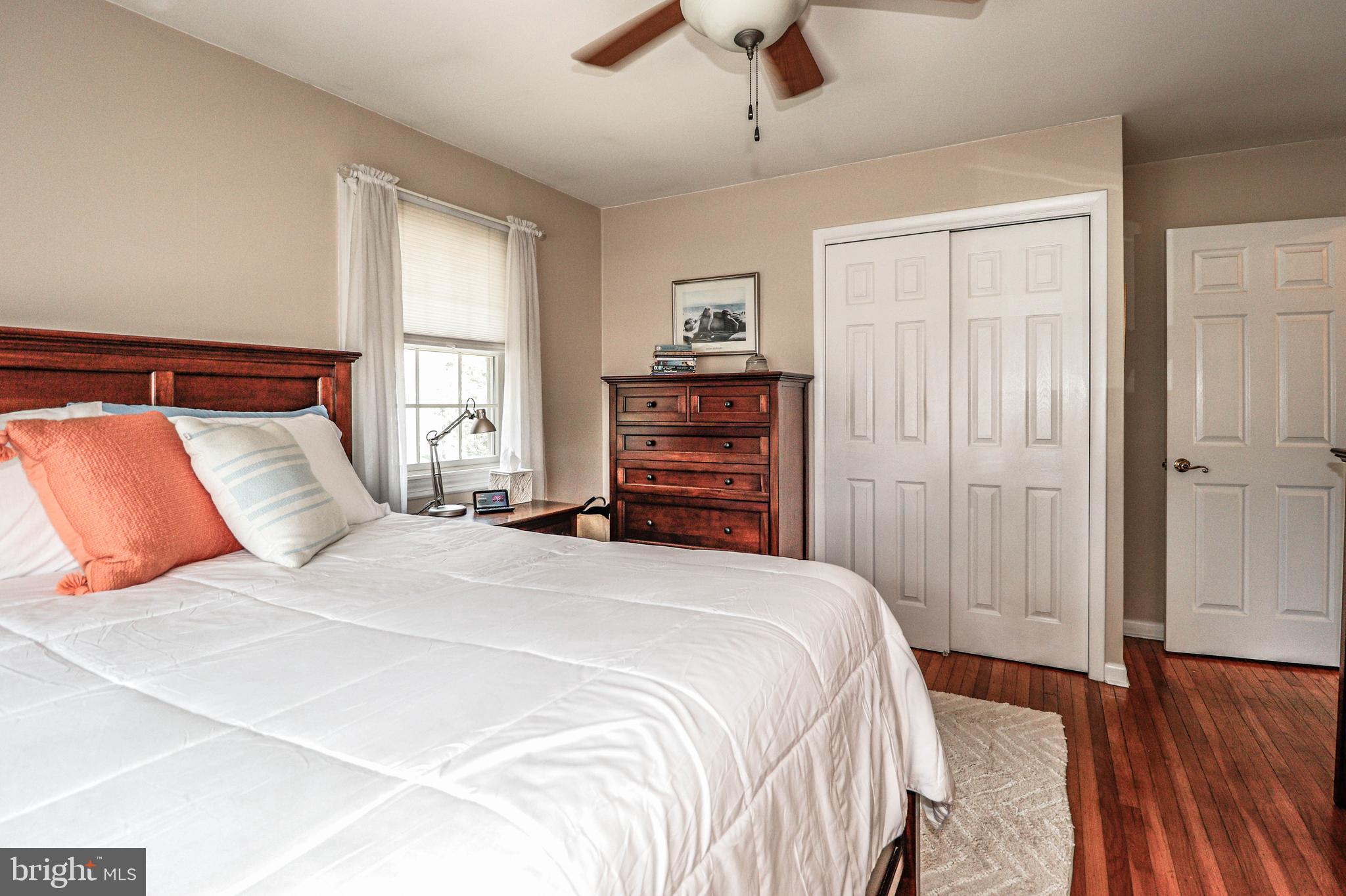 94 Winding Way Hamilton, NJ 08620 - Photo 28 of 38 a bedroom with a bed and wooden floor