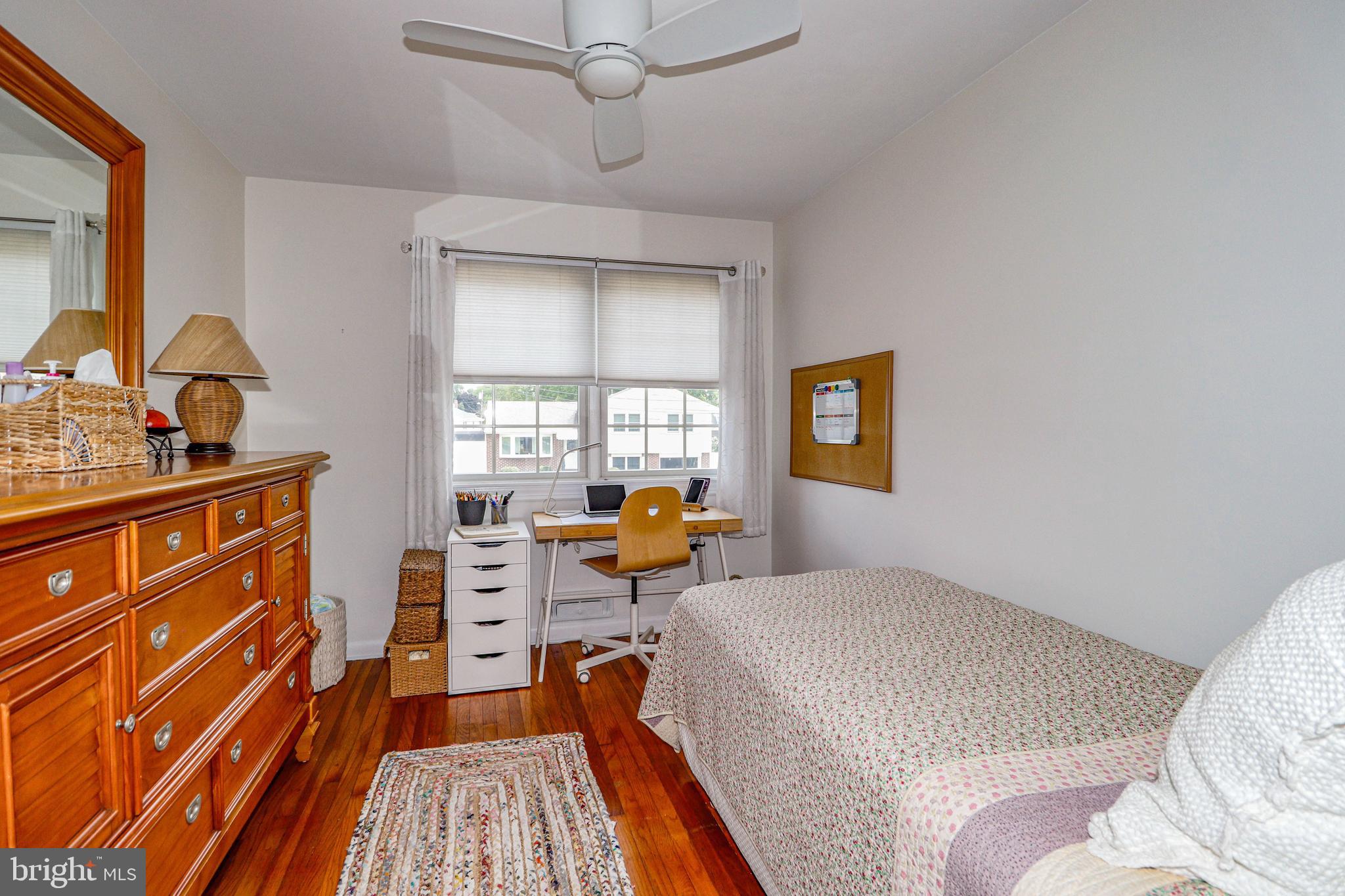 94 Winding Way Hamilton, NJ 08620 - Photo 29 of 38 a bedroom with a bed and wooden floor