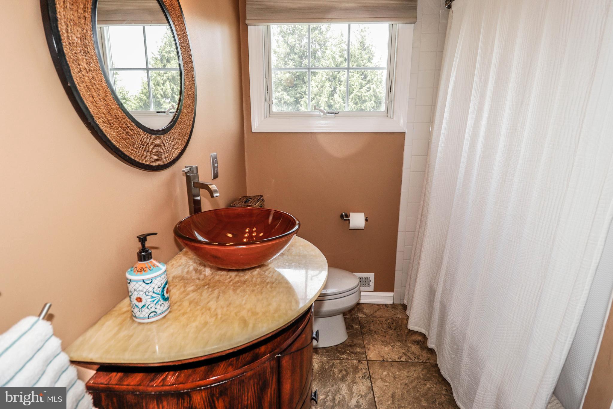 94 Winding Way Hamilton, NJ 08620 - Photo 30 of 38 a bathroom with a toilet and a sink