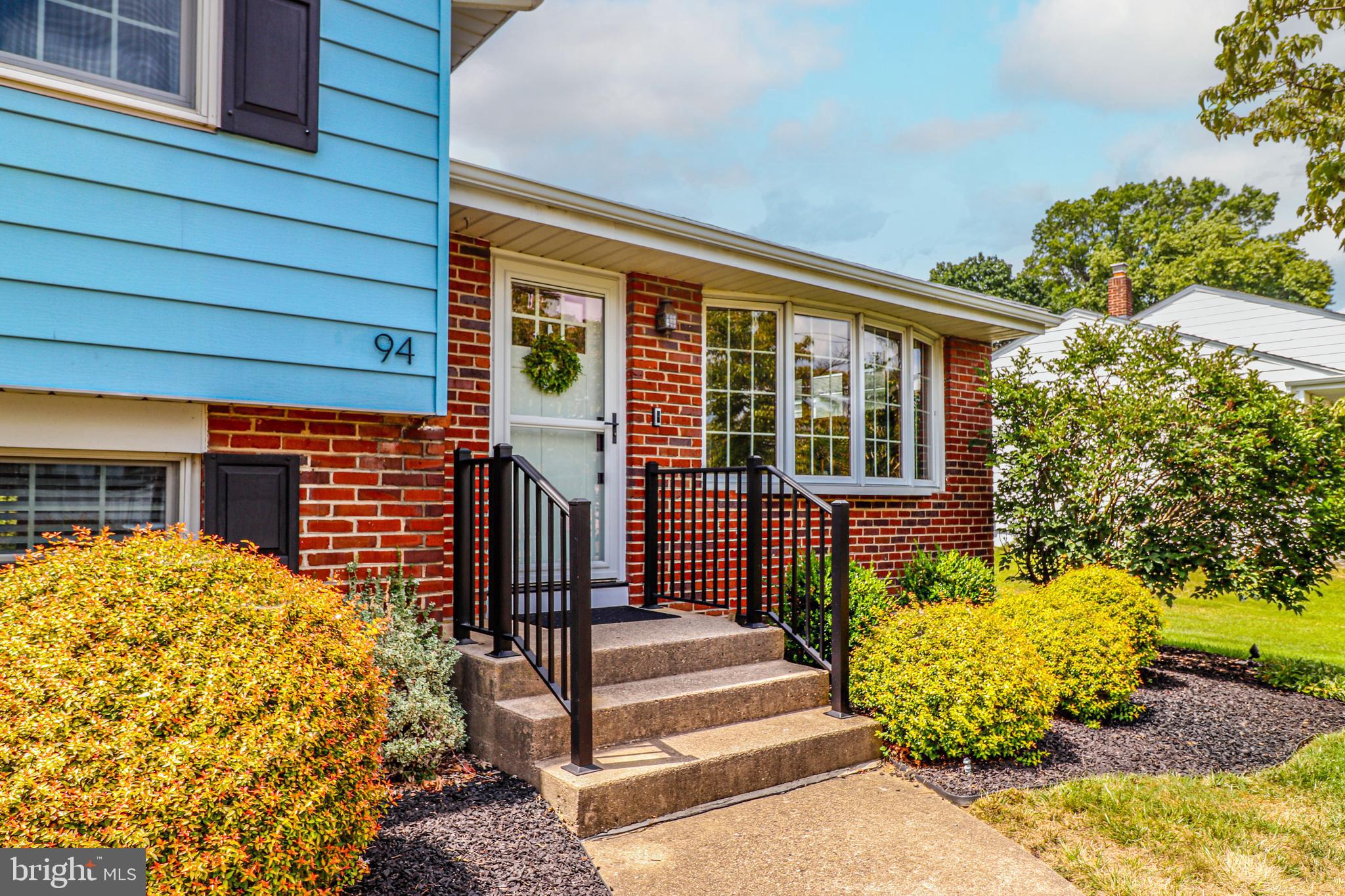 94 Winding Way Hamilton, NJ 08620 - Photo 3 of 38 a front view of a house with a garden
