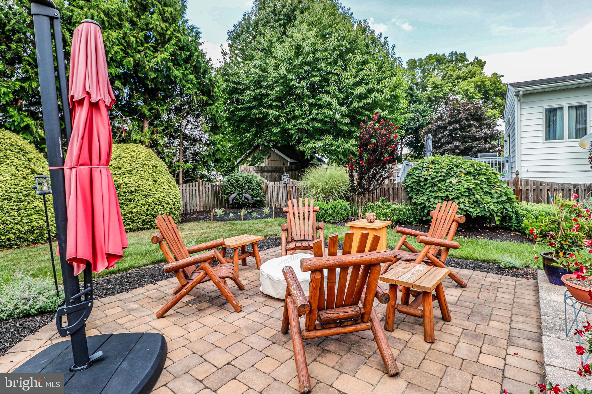 94 Winding Way Hamilton, NJ 08620 - Photo 34 of 38 a backyard of a house with outdoor seating