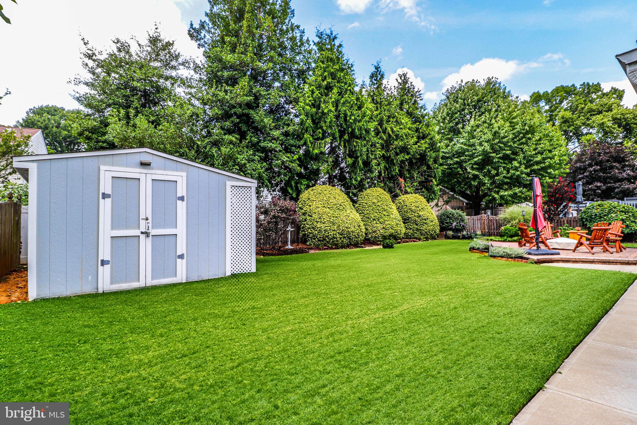94 Winding Way Hamilton, NJ 08620 - Photo 38 of 38 a view of a backyard with potted plants and large tree