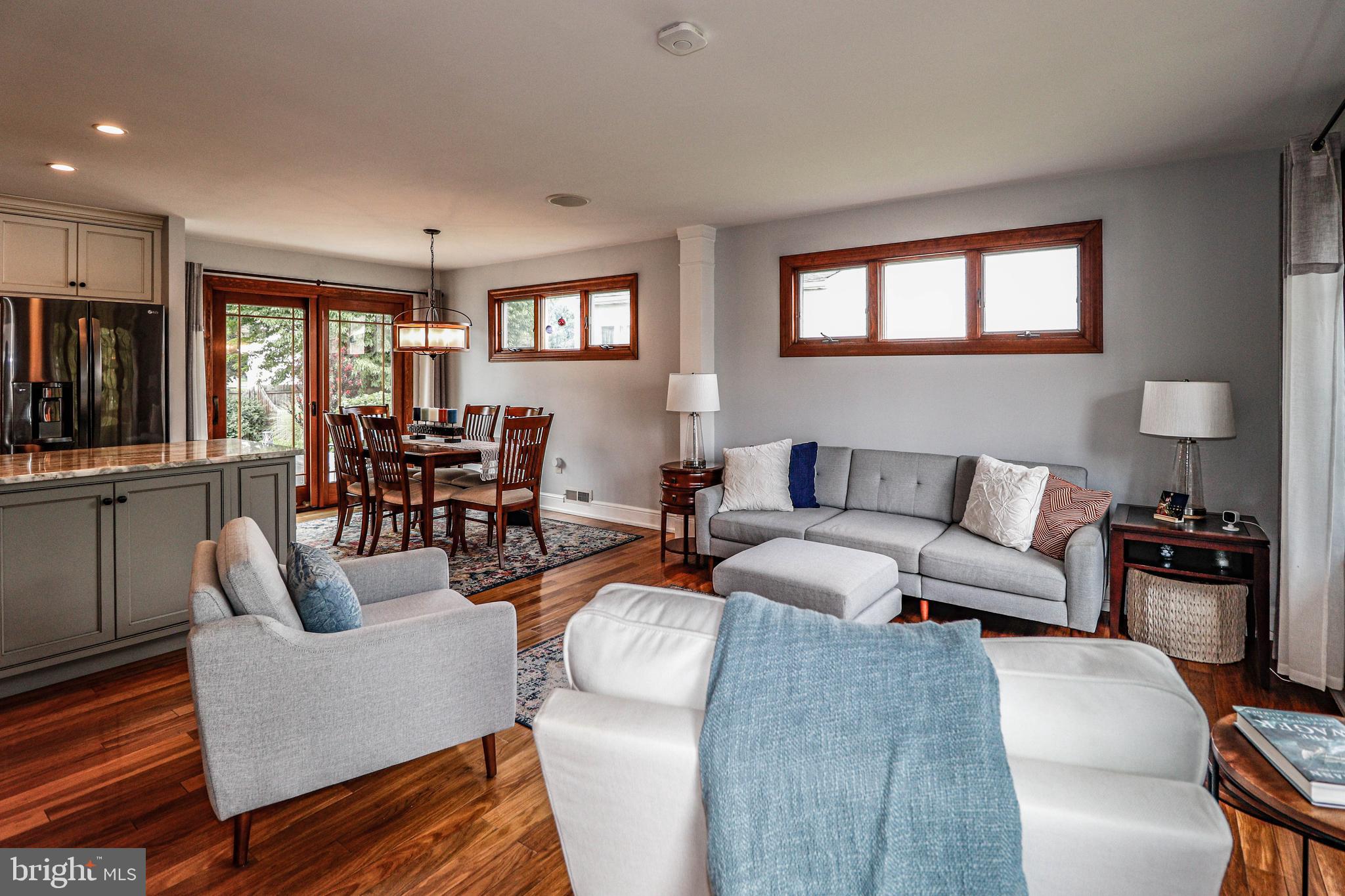94 Winding Way Hamilton, NJ 08620 - Photo 6 of 38 a living room with furniture flat screen tv and windows