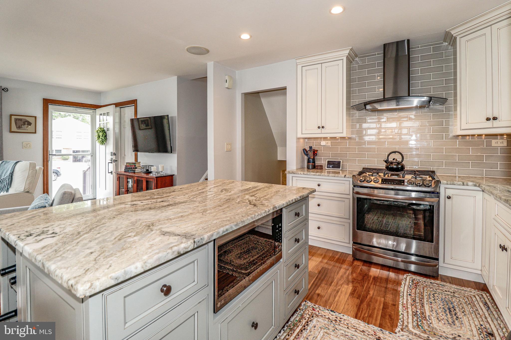 94 Winding Way Hamilton, NJ 08620 - Photo 10 of 38 a kitchen with granite countertop a sink stove and refrigerator