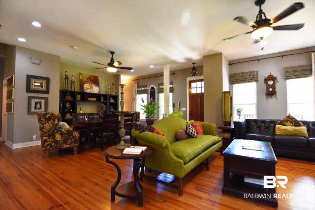 13848 Elmwood Court Stapleton, AL 36578 - Photo 26 of 27 Designed for entertaining! Open Floor Plan with tall smooth ceilings and heart pine floors. This lovely home is modeled after the Southern Living Coastal Cottage of the Year. Warm and welcoming.