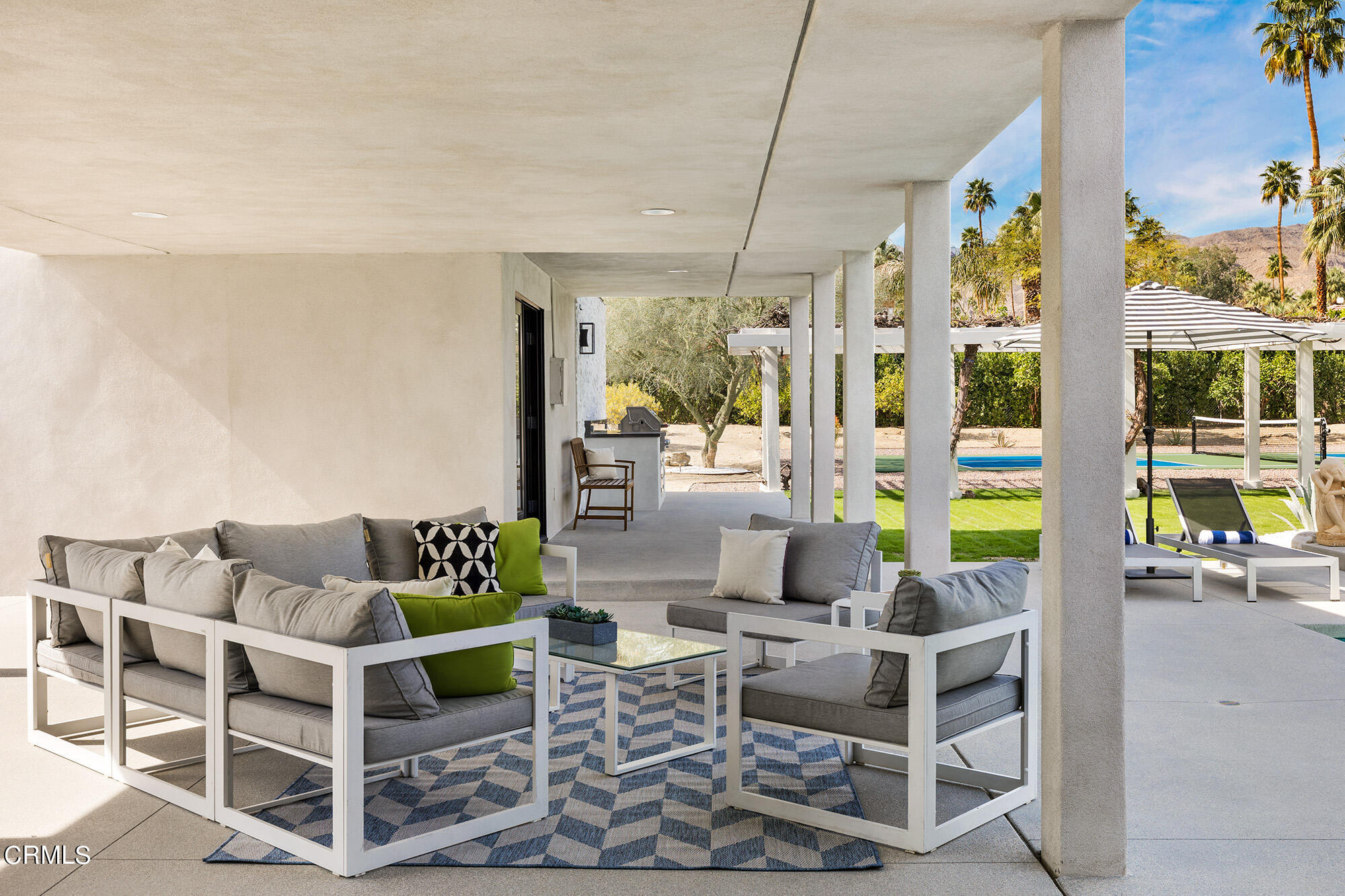 71817 Sahara Road Rancho Mirage, CA 92270 - Photo 19 of 25 a view of a dining room with furniture one side kitchen view