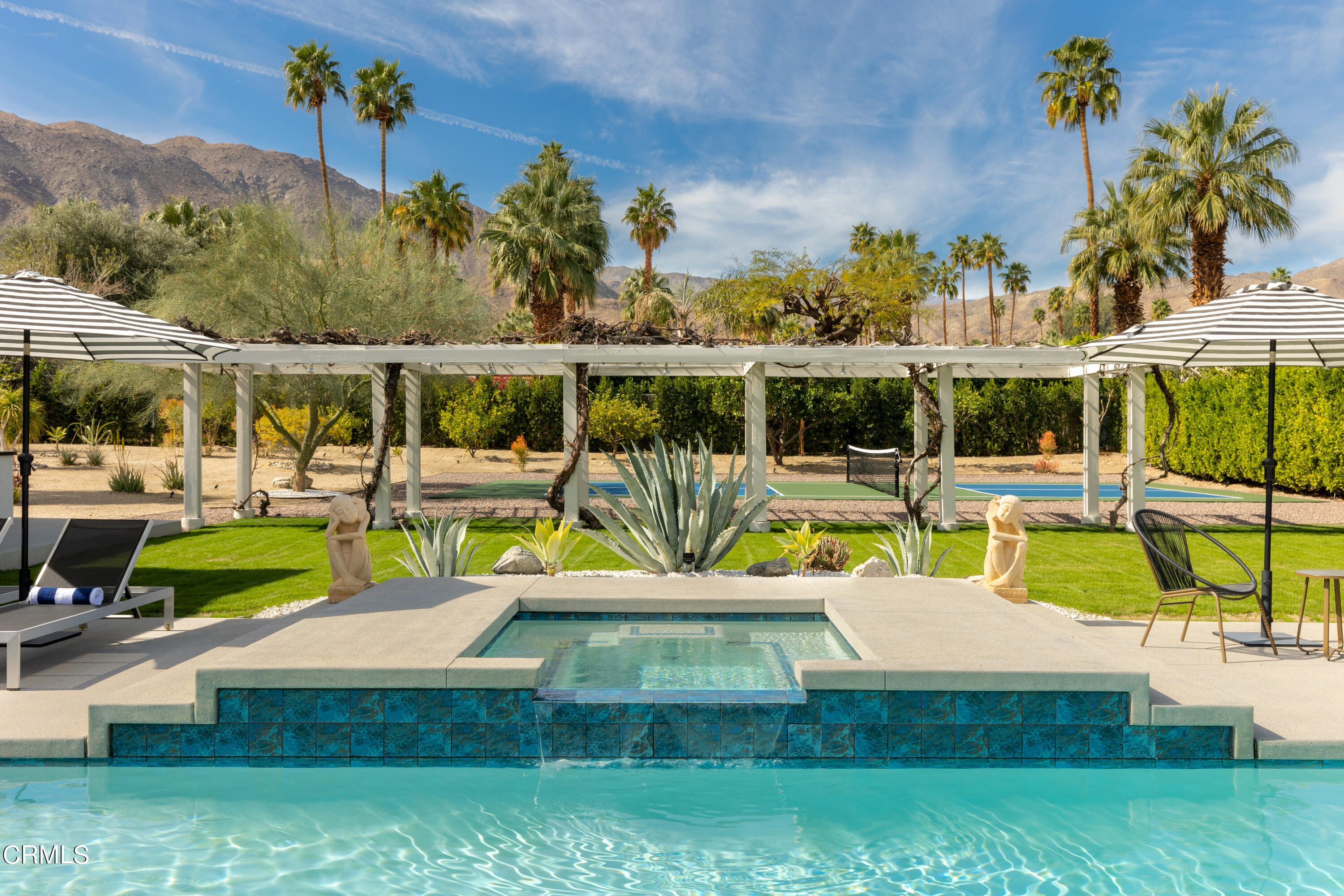 71817 Sahara Road Rancho Mirage, CA 92270 - Photo 21 of 25 a view of a swimming pool with a patio and a garden