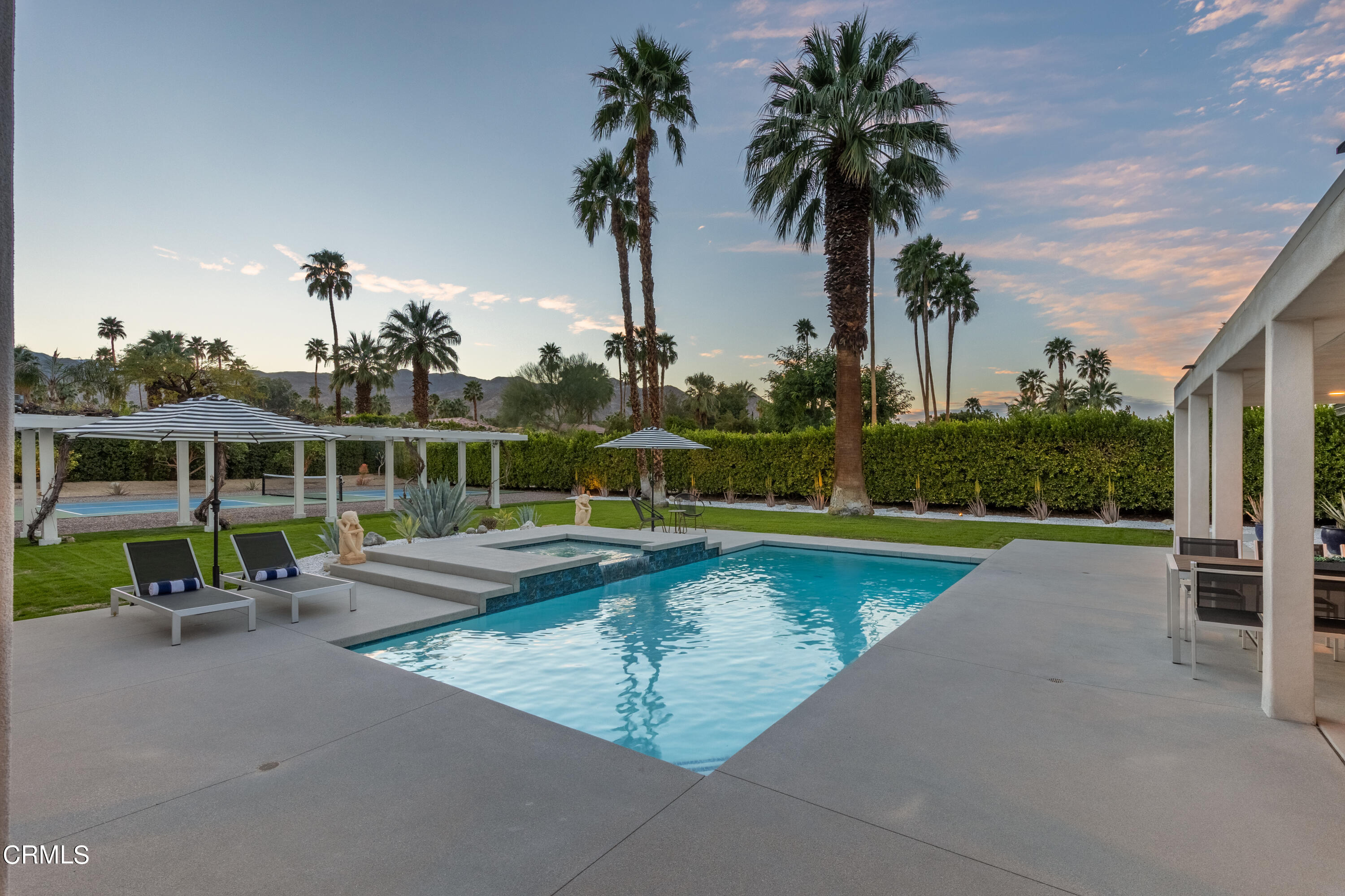 71817 Sahara Road Rancho Mirage, CA 92270 - Photo 22 of 25 a view of a swimming pool with a patio and a yard