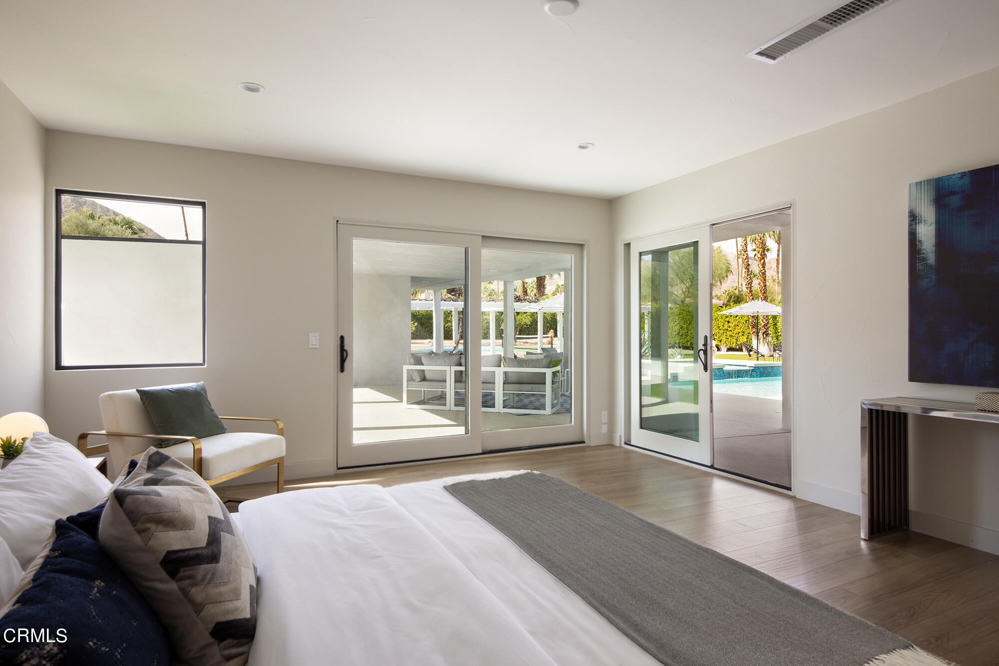 71817 Sahara Road Rancho Mirage, CA 92270 - Photo 10 of 25 a bedroom with a balcony a bed and a television