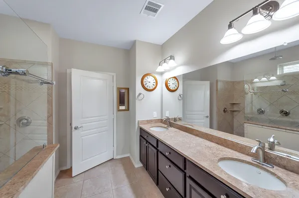 a kitchen with stainless steel appliances granite countertop a sink refrigerator and microwave