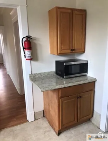 a kitchen with a sink and a microwave