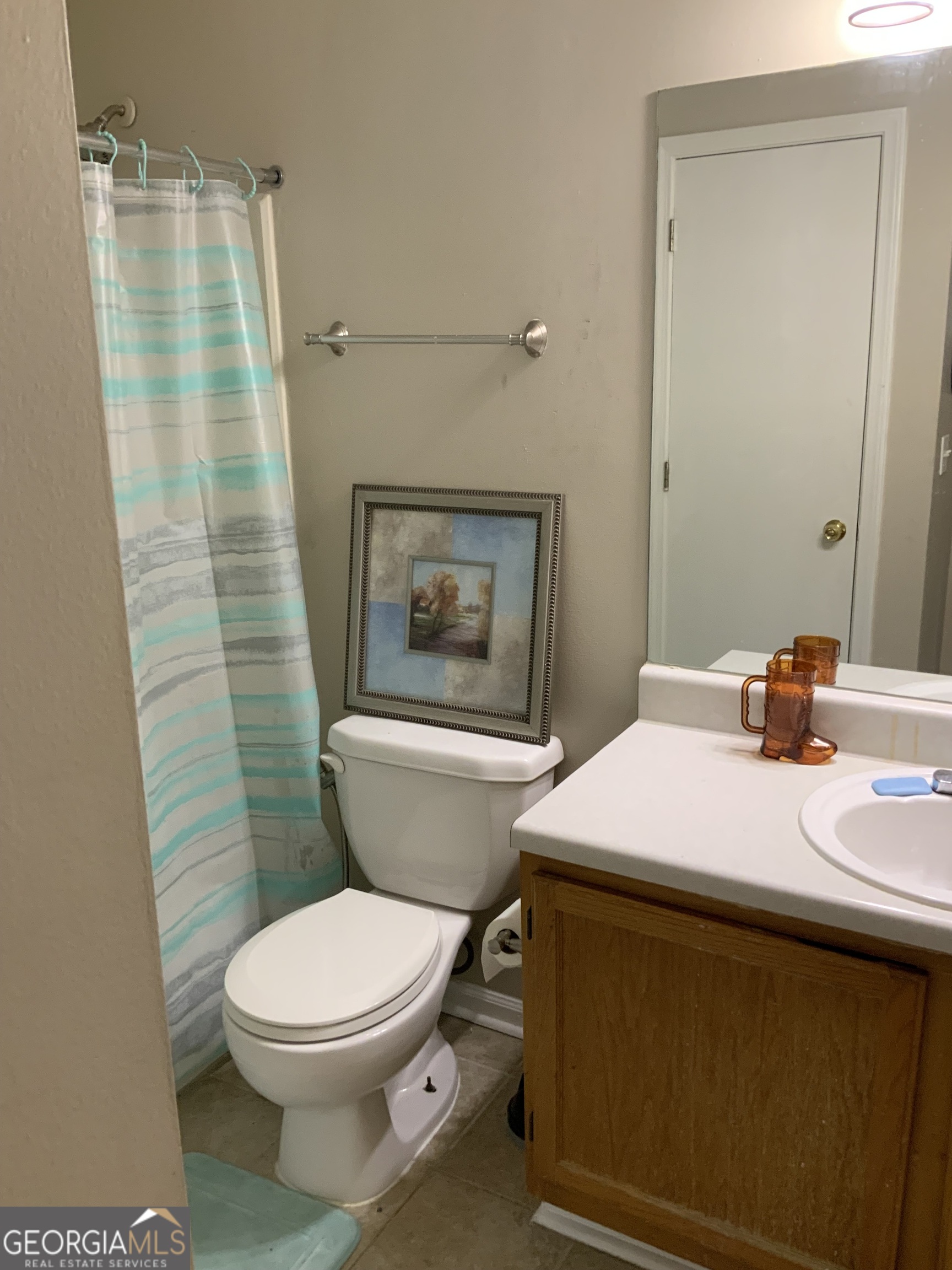 3526 Shepherds Path, Unit 1 Decatur, GA 30034 - Photo 20 of 26 a bathroom with a sink a toilet a mirror and shower