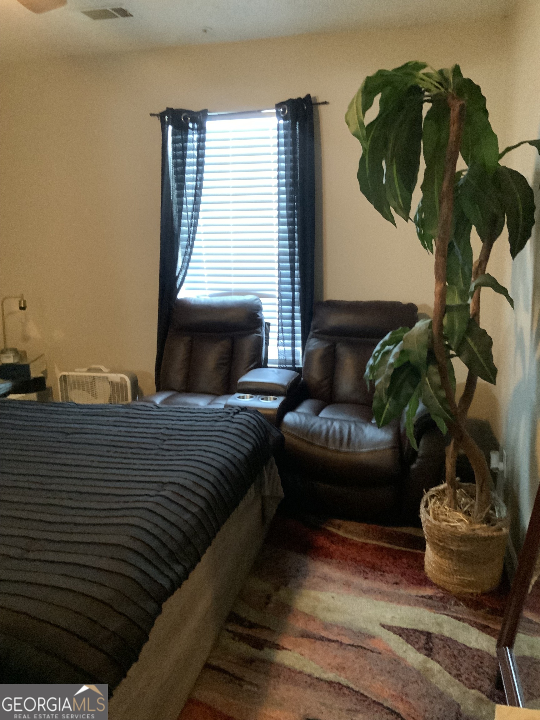 3526 Shepherds Path, Unit 1 Decatur, GA 30034 - Photo 23 of 26 a bedroom with a bed potted plant and a window