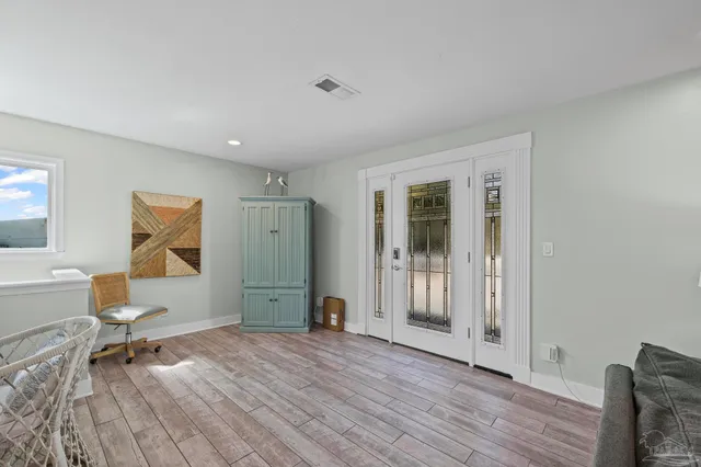 a large kitchen with kitchen island a stove a sink a dining table and chairs