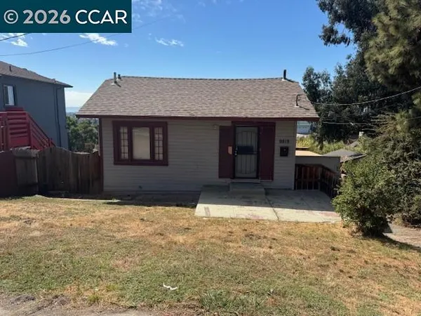 a house with yard in front of it