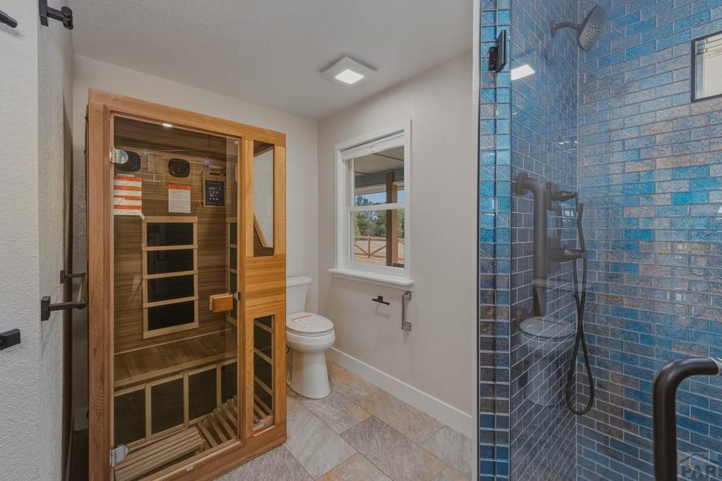 23360 Monarch Road Aguilar, CO 81020 - Photo 18 of 52 a bathroom with a toilet and a shower