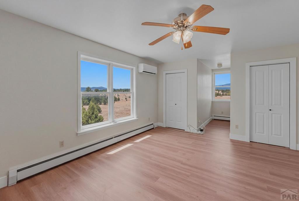 23360 Monarch Road Aguilar, CO 81020 - Photo 27 of 52 wooden floor in an empty room with a window