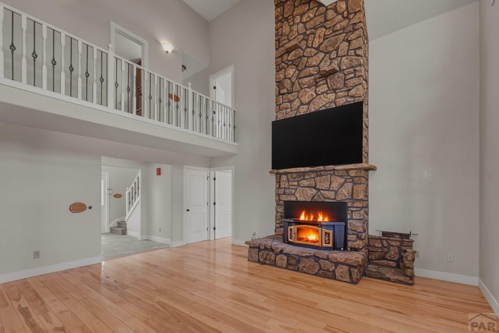 23360 Monarch Road Aguilar, CO 81020 - Photo 8 of 52 a view of an empty room with wooden floor fireplace and a window