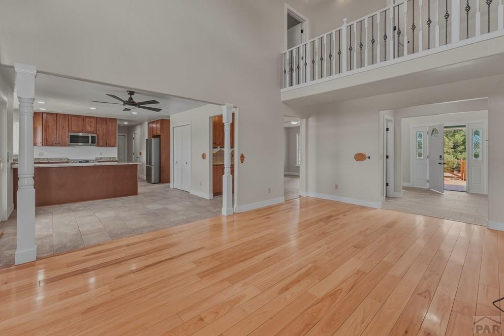 23360 Monarch Road Aguilar, CO 81020 - Photo 10 of 52 a view of a hallway with wooden cabinet and chandelier