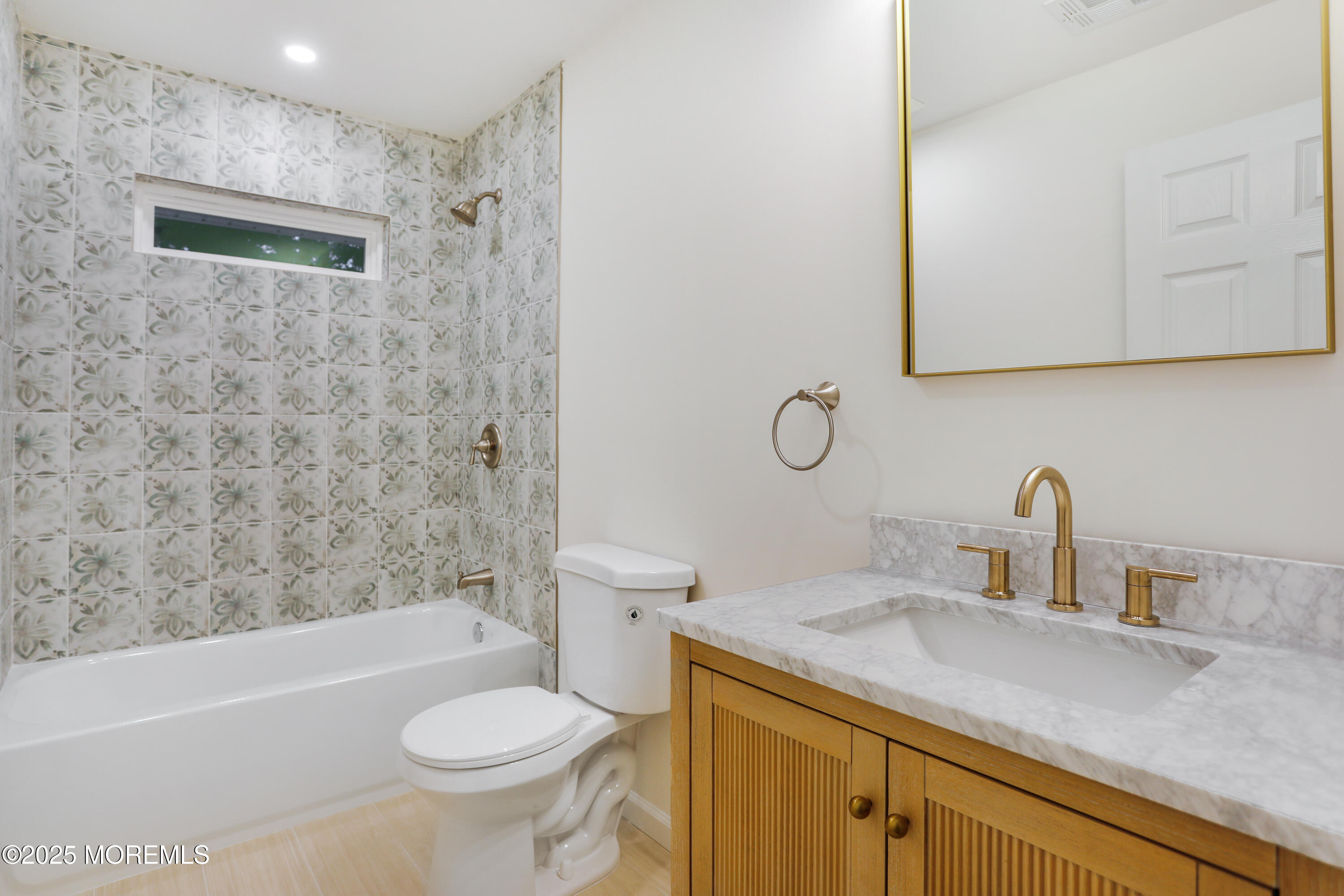 2401 Mallow Street Point Pleasant, NJ 08742 - Photo 15 of 20 a bathroom with a sink toilet vanity granite shower and bathtub