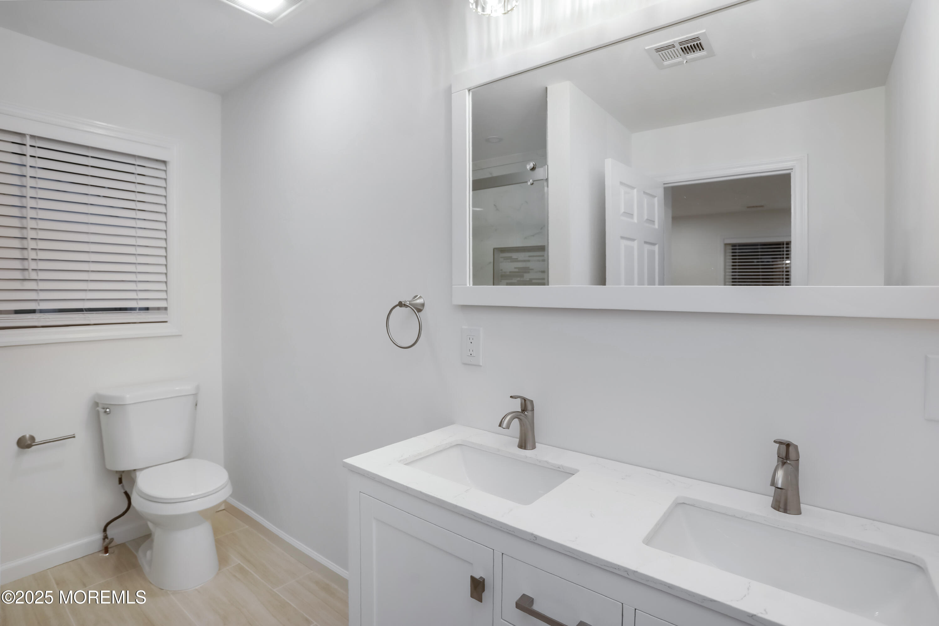 2401 Mallow Street Point Pleasant, NJ 08742 - Photo 19 of 20 a bathroom with a sink and a toilet