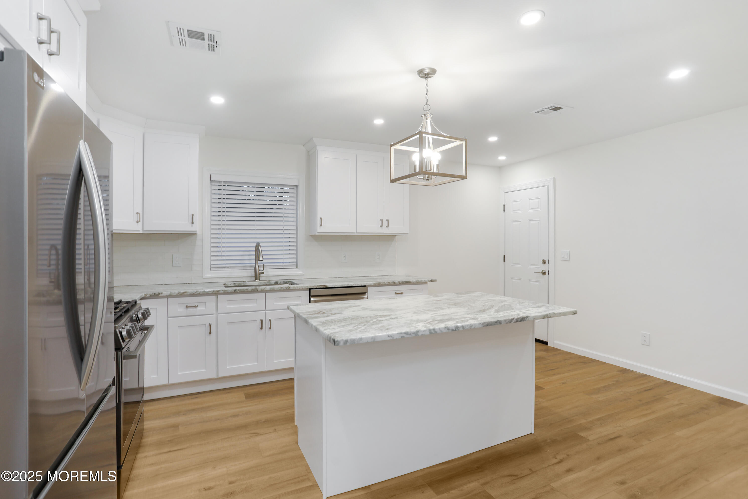 2401 Mallow Street Point Pleasant, NJ 08742 - Photo 8 of 20 a kitchen that has a sink stainless steel appliances a counter space and cabinets