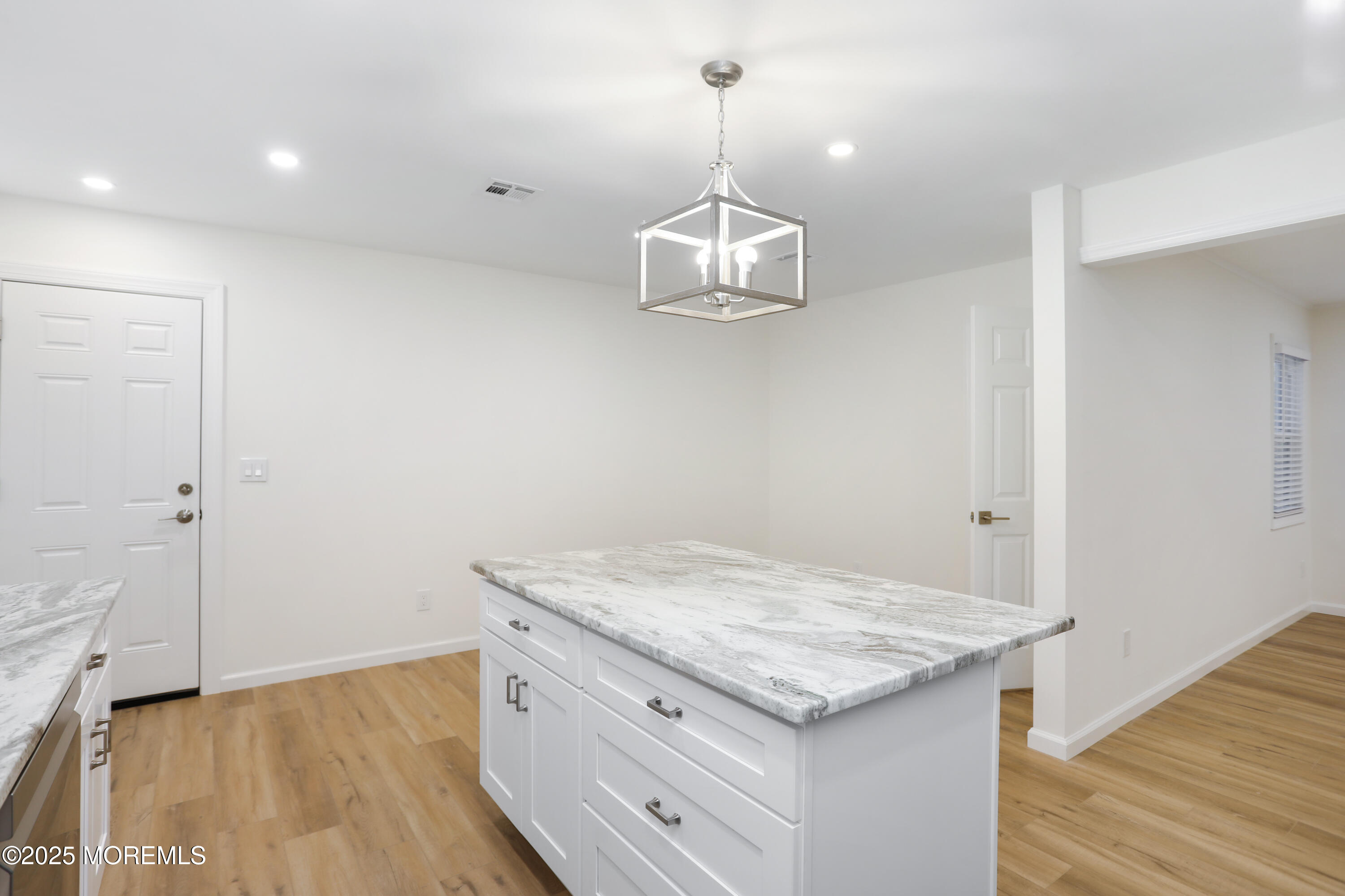 2401 Mallow Street Point Pleasant, NJ 08742 - Photo 10 of 20 a kitchen with a granite countertop sink and refrigerator