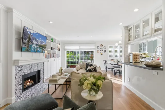 a living room with furniture fireplace and a flat screen tv