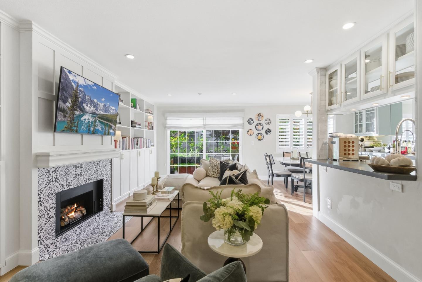 a living room with furniture fireplace and a flat screen tv