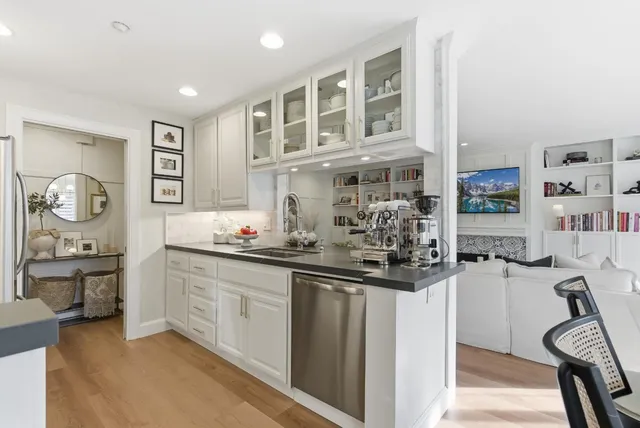 a kitchen with cabinets and window