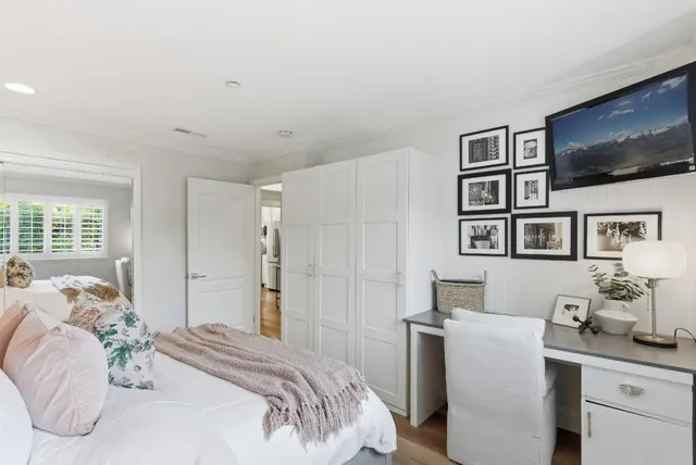 a bathroom with a sink mirror vanity and toilet