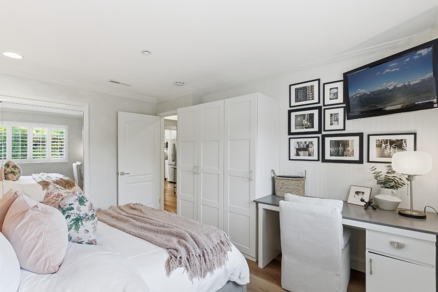 20 Willow Road, Unit 7 Menlo Park, CA 94025 - Photo 16 of 24 a bedroom with a bed and a flat screen tv