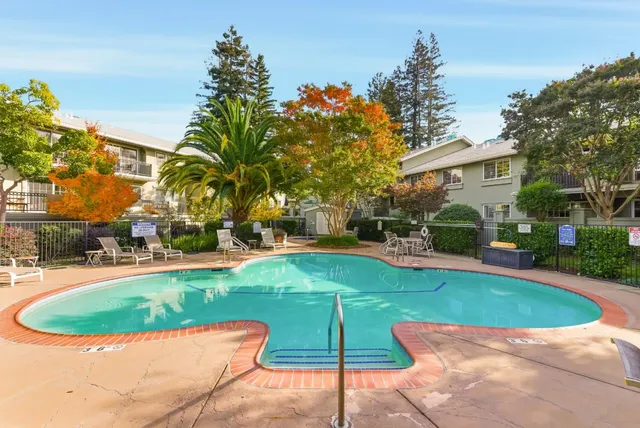 a view of a swimming pool with a patio