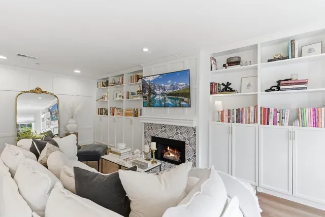 a living room with furniture and a fireplace