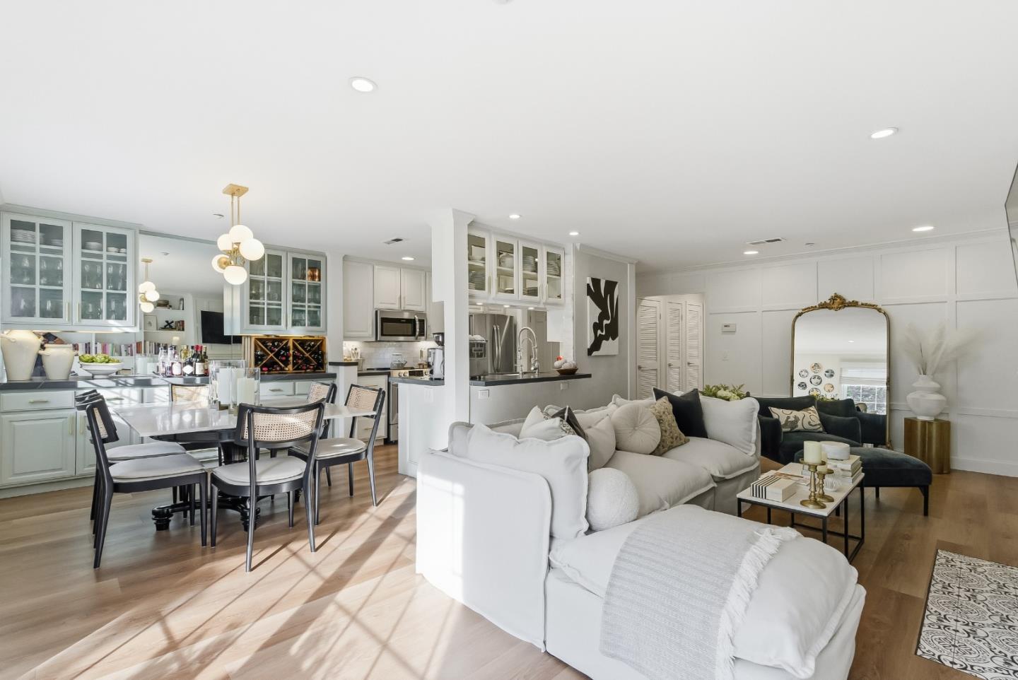 20 Willow Road, Unit 7 Menlo Park, CA 94025 - Photo 6 of 24 a living room with furniture and a large mirror with wooden floor