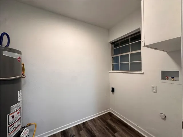 a view of storage and utility room with wooden floor