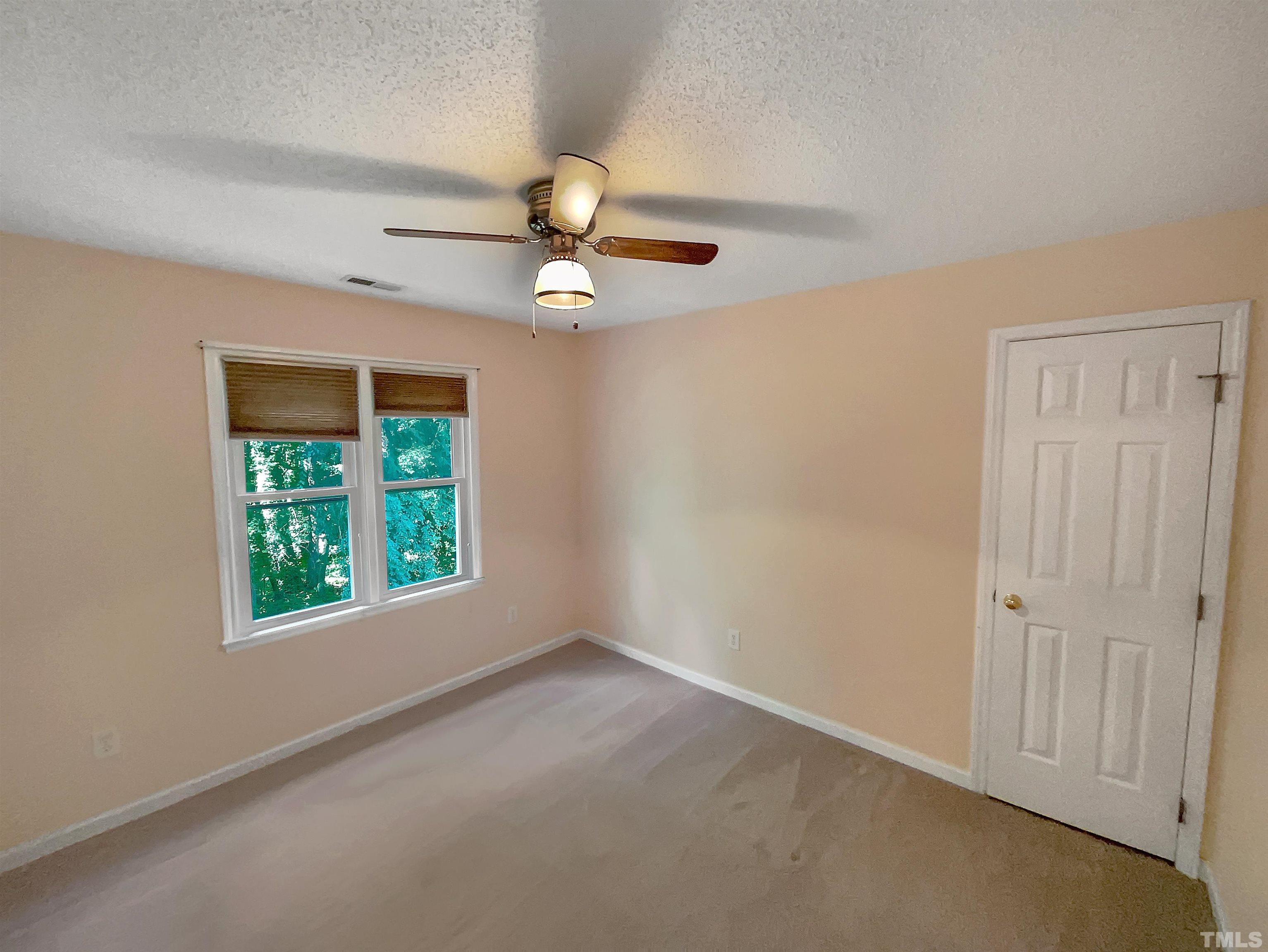 5225 Knightsbridge Way Raleigh, NC 27604 - Photo 18 of 21 an empty room with windows and fan