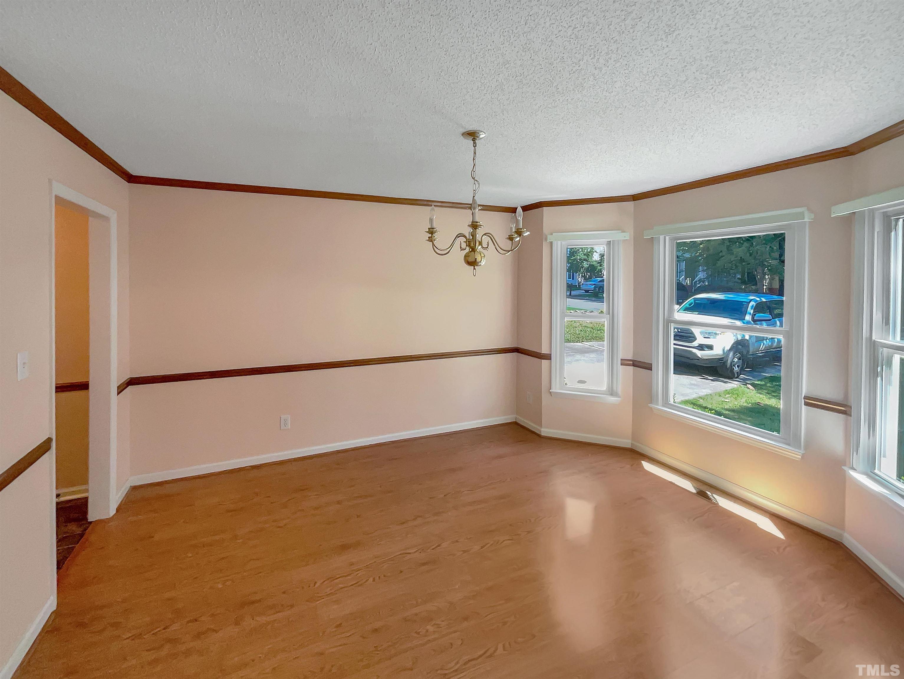 5225 Knightsbridge Way Raleigh, NC 27604 - Photo 8 of 21 an empty room with windows and entrance
