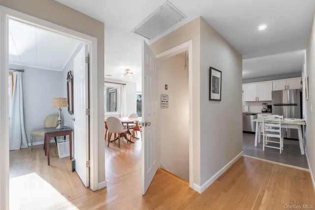 a bedroom with a bed chair and a window
