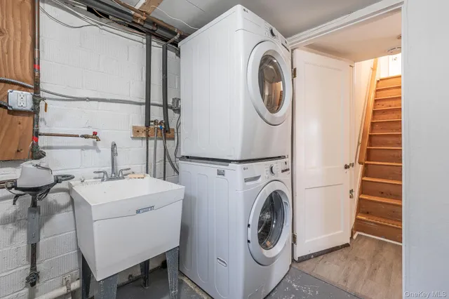 a roof deck with table and chairs