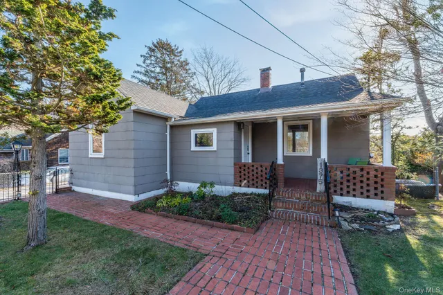 a view of porch with furniture and a yard