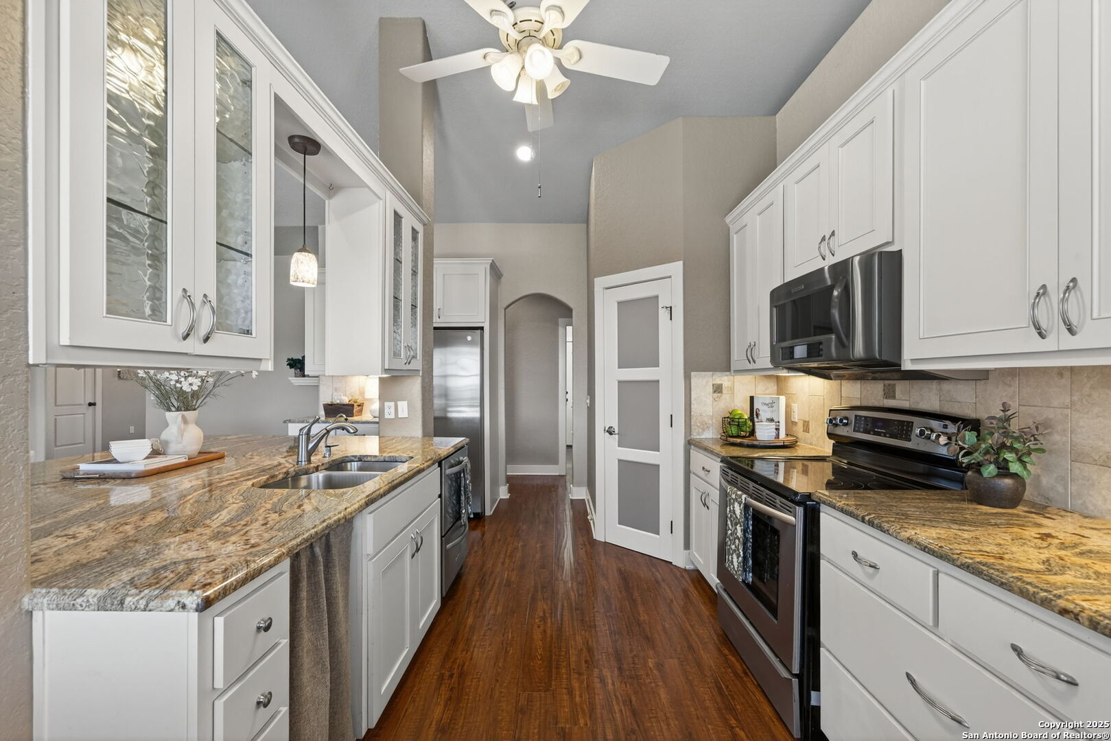 905 Cypress Pass Road Spring Branch, TX 78070 - Photo 13 of 42 a kitchen with stainless steel appliances granite countertop a sink stove and refrigerator