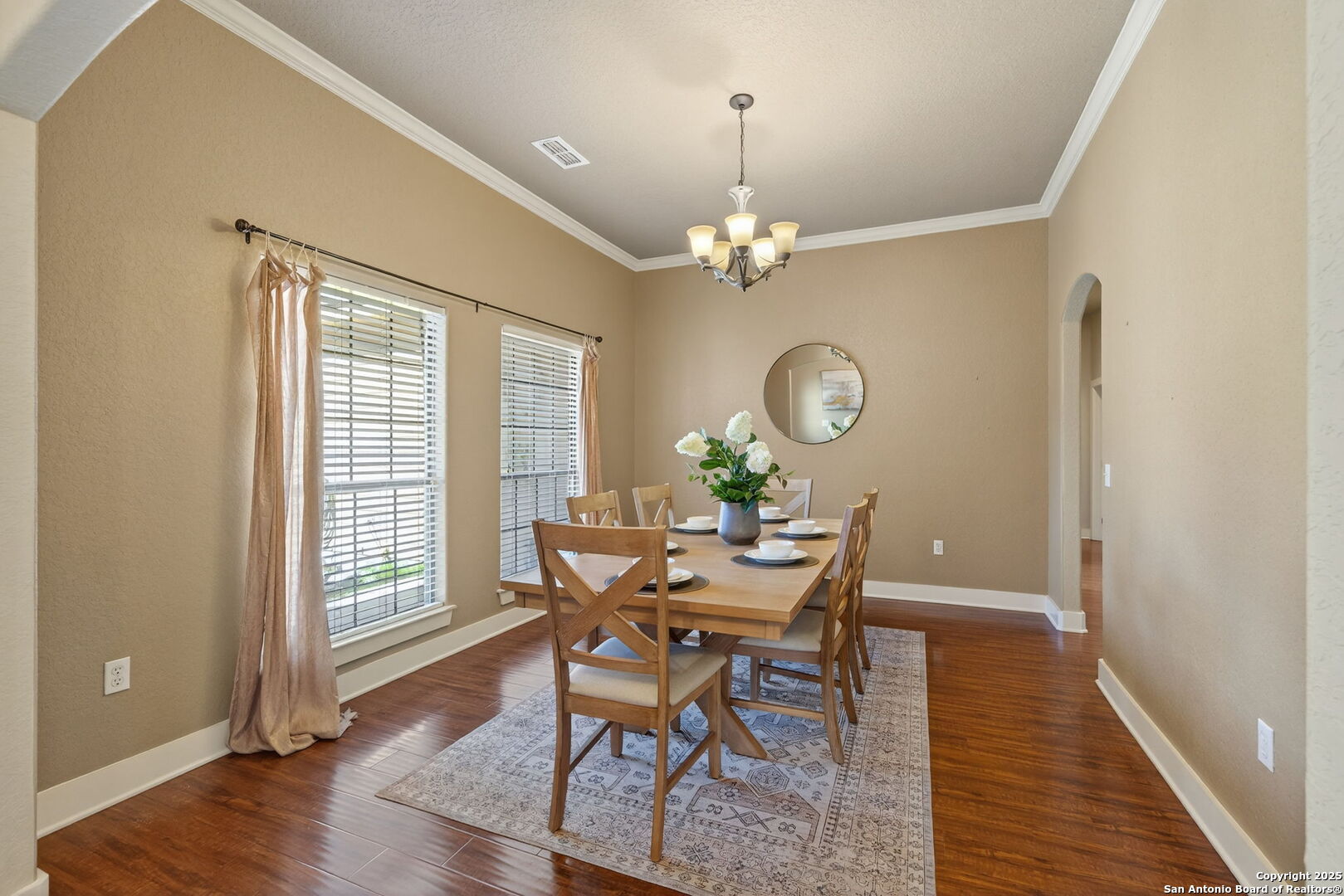 905 Cypress Pass Road Spring Branch, TX 78070 - Photo 15 of 42 a view of a dining room with furniture a chandelier and wooden floor