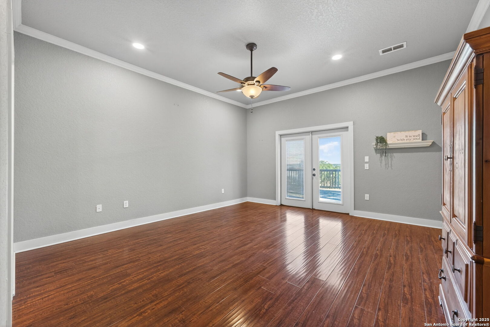 905 Cypress Pass Road Spring Branch, TX 78070 - Photo 18 of 42 wooden floor in an empty room with a window