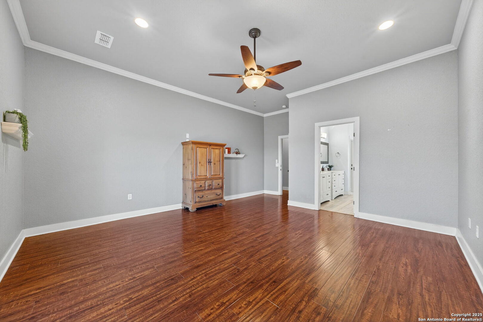 905 Cypress Pass Road Spring Branch, TX 78070 - Photo 20 of 42 a view of an empty room with window and wooden floor